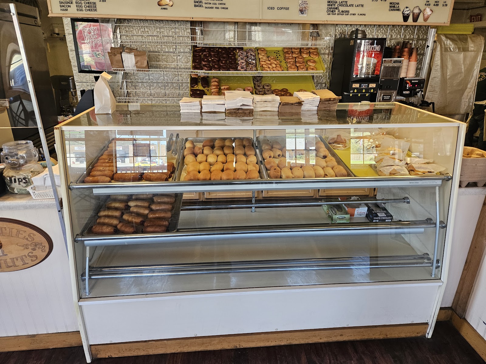 Case full of fresh kolaches and sausage rolls at Sweeties Donuts