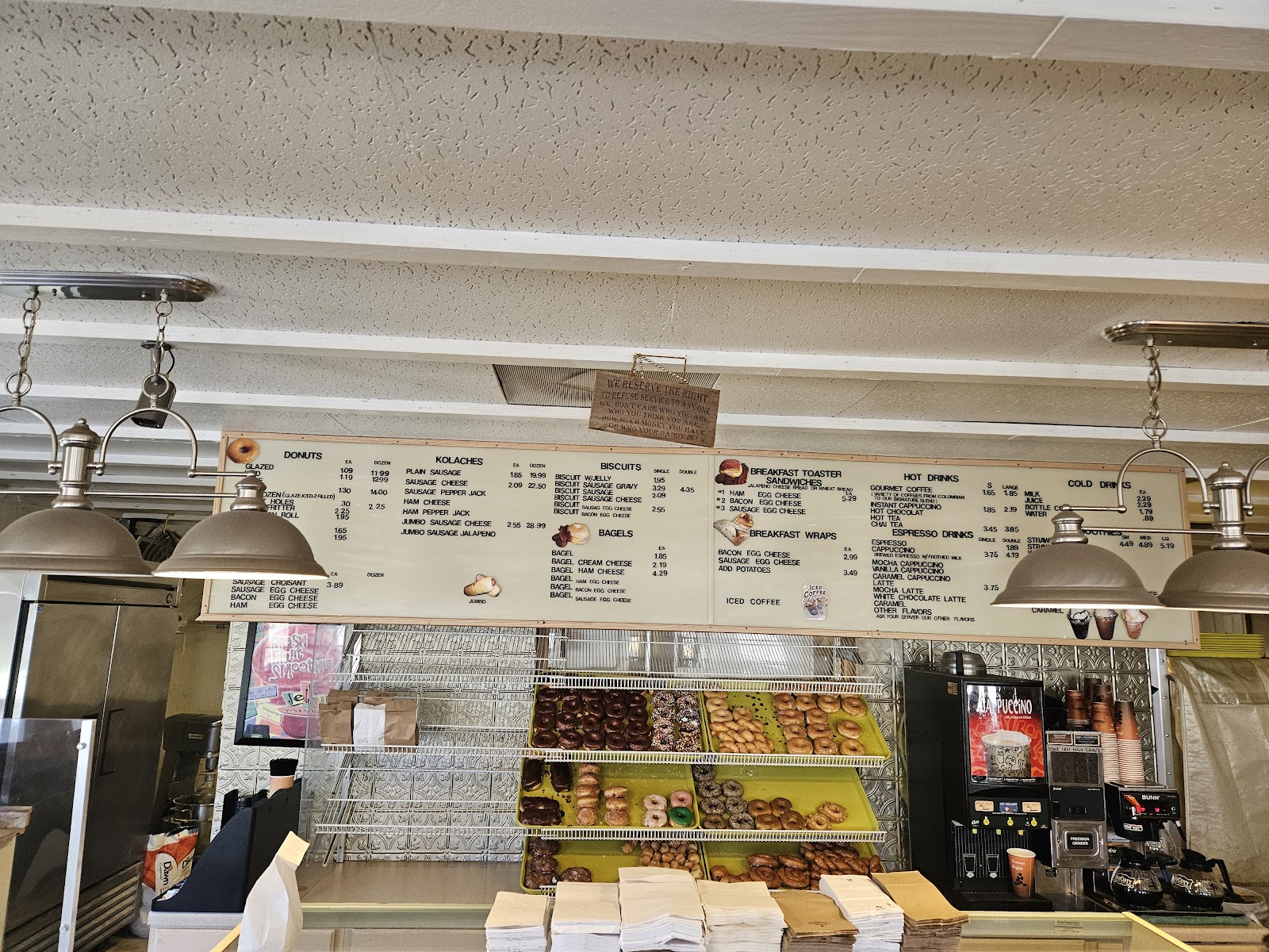 Menu board and donut display case at Sweeties Donuts